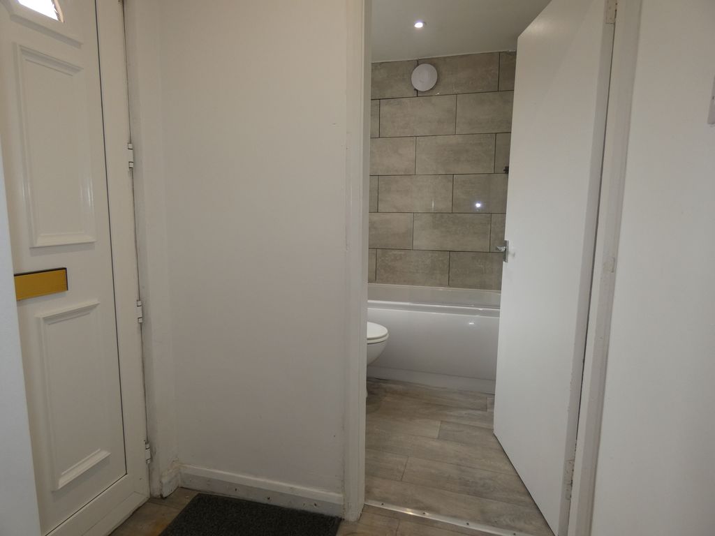 Rear Lobby into Bathroom- click for photo gallery